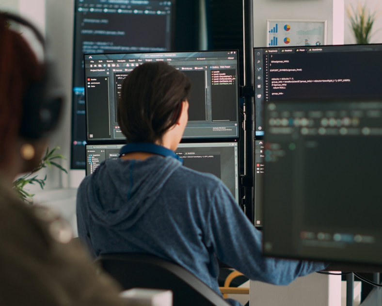 Database programer writing code on terminal window using multiple monitors in it agency office. System software developer typing database information, computing big data script.